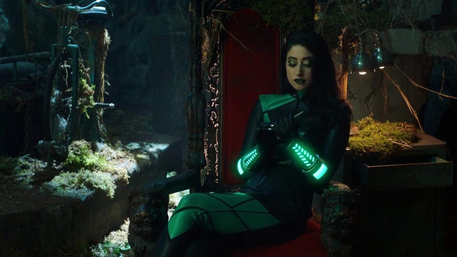Taylor Ortega, as Shego, sits in a throne and files her nails.